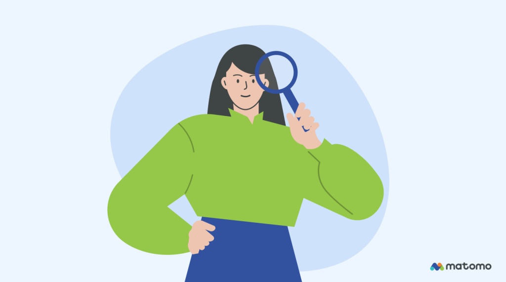 A woman holding a magnifying glass up to her eye